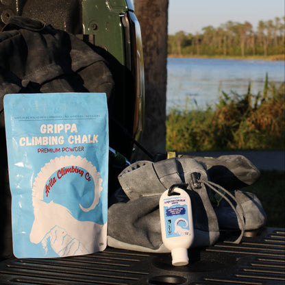 Grippa climbing chalk package on a vehicle's open door with a natural background