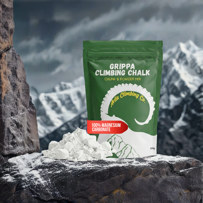 Grippa Climbing Chalk packaging with white chalk on a rocky surface with mountain background