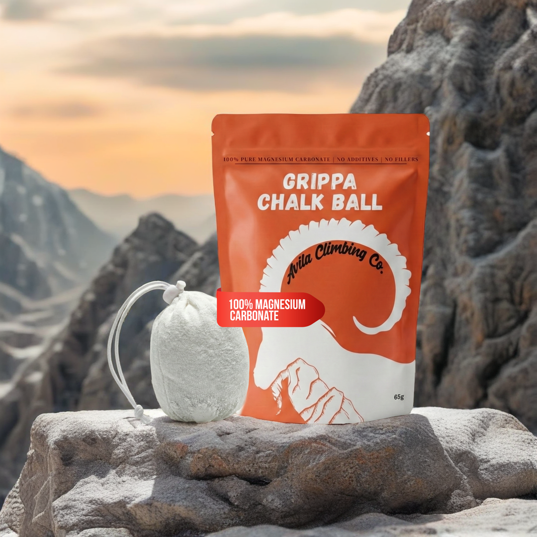 Grippa Chalk Ball packaging with a chalk ball on a rocky surface with mountains in the background