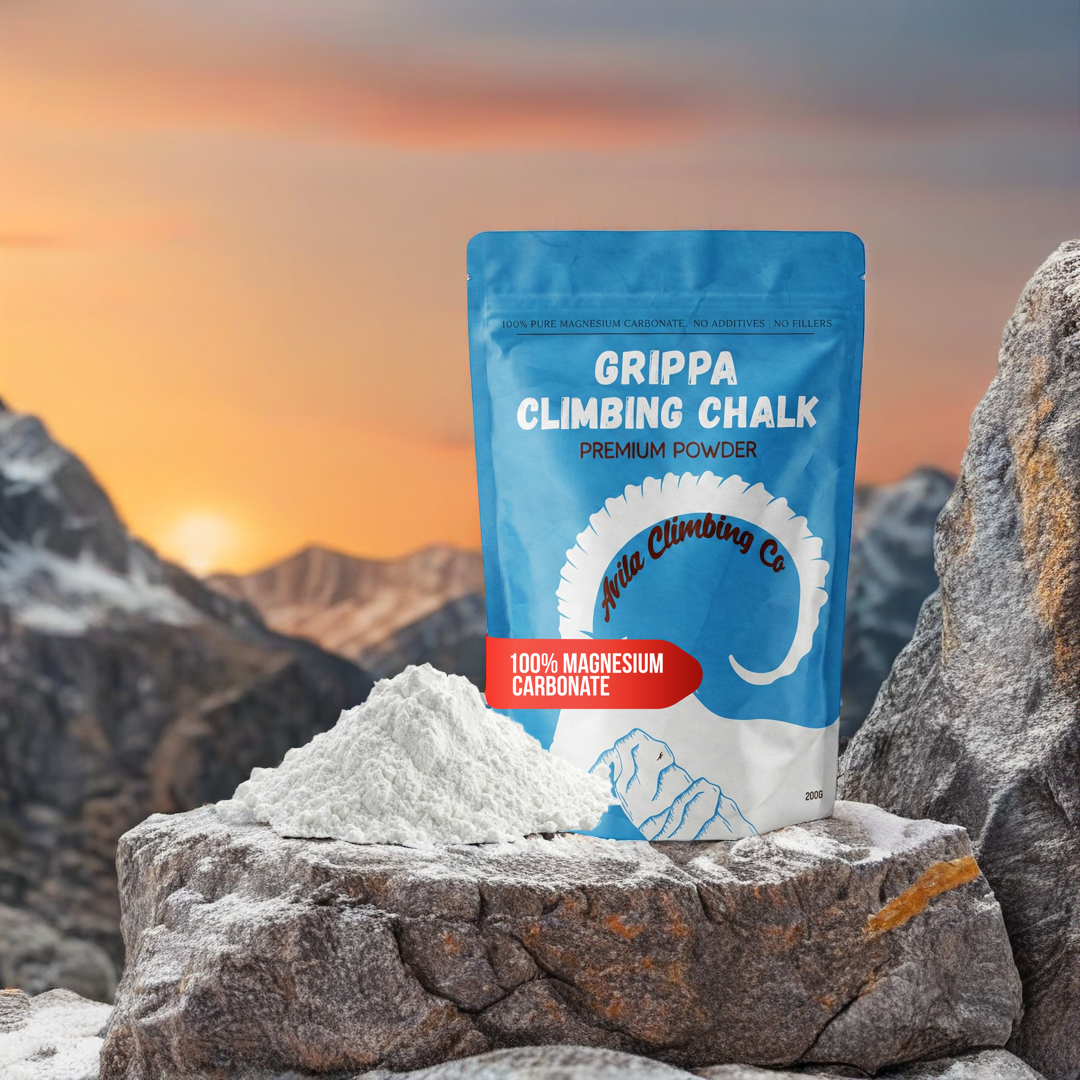 Grippa Climbing Chalk packaging on a rock with a mountainous landscape in the background